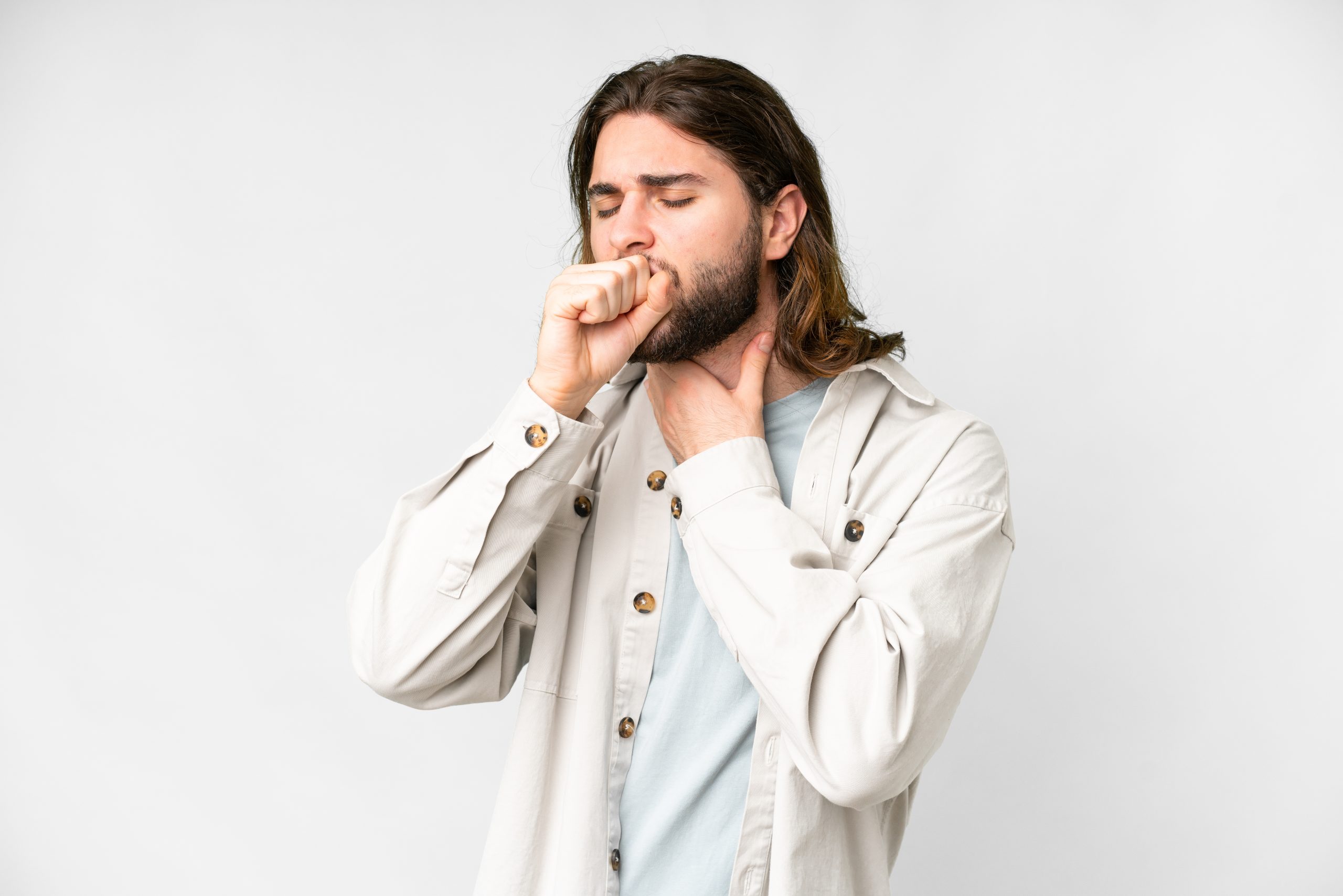 Young handsome man over isolated white background coughing a lot